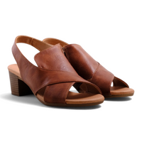 Step Ahead Flone Lift tan sandals featuring a crisscross strap design, open toe, and a comfortable block heel.