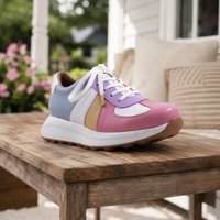 Step Ahead Froggie 12688 pastel leather sneaker with memory foam, white laces, and a non-slip sole on a wooden table.