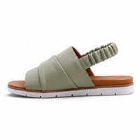Step Ahead Pesso Beni sage green leather sandal with ruched upper, elasticated backstrap, and white rubber sole.