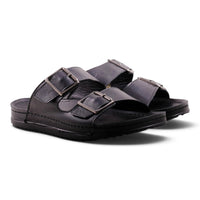 Step Ahead Pesso men's all-black leather slide sandals with dual adjustable buckle straps and a contoured footbed.