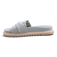 Step Ahead Pesso Borgan Aqua slide sandals in light blue leather with a knotted strap and textured beige sole