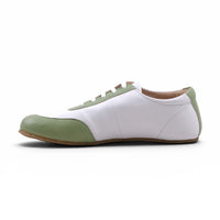 Step Ahead Pesso Mathias barefoot leather sneaker in white and nude with a flexible rubber sole, side view.