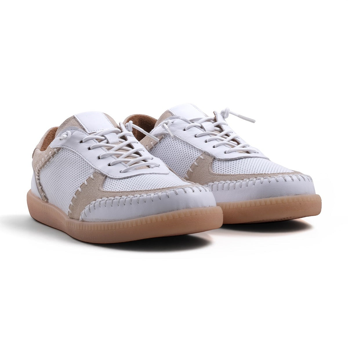 Step Ahead Pesso Penelope white leather and suede sneakers with intricate stitching and a caramel rubber sole.