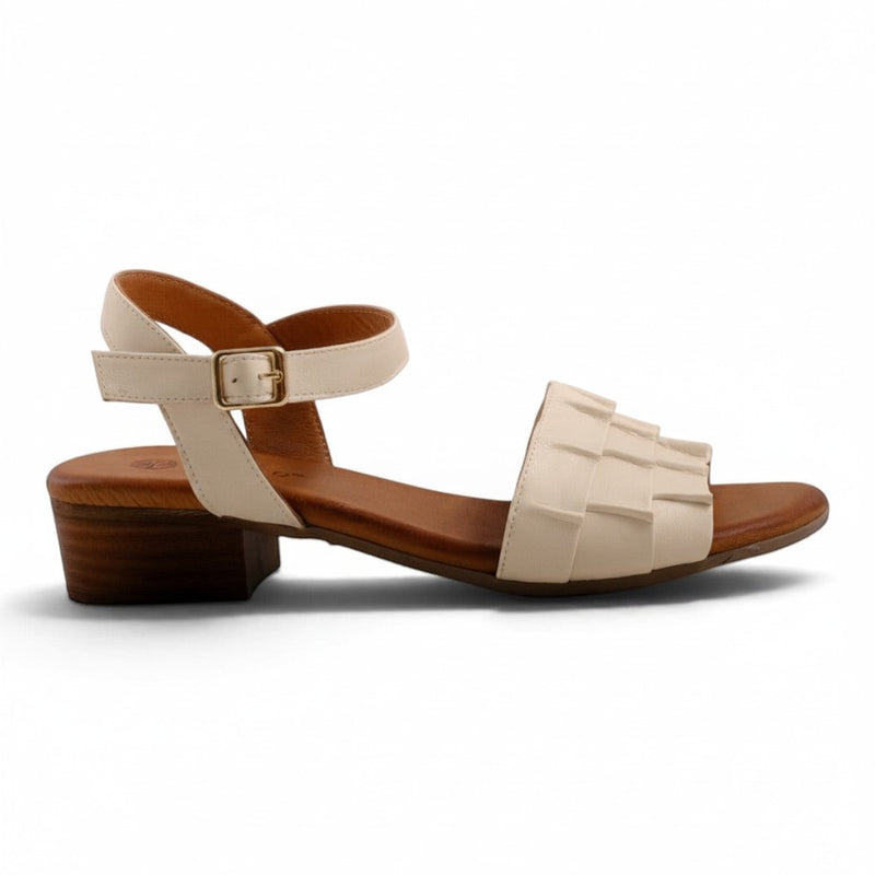 Step Ahead Pesso Shalsa cream leather block-heel sandal with a woven strap design and adjustable ankle buckle.