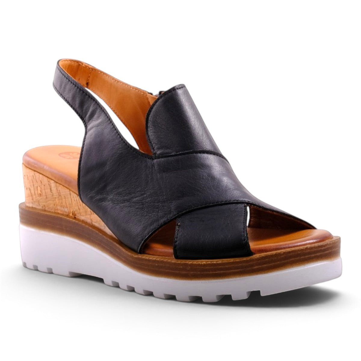 Step Ahead Pesso Well black leather wedge sandals with a cork midsole and white lugged rubber outsole.