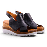 Step Ahead Pesso Well black leather wedge sandals with side zipper and white lug sole